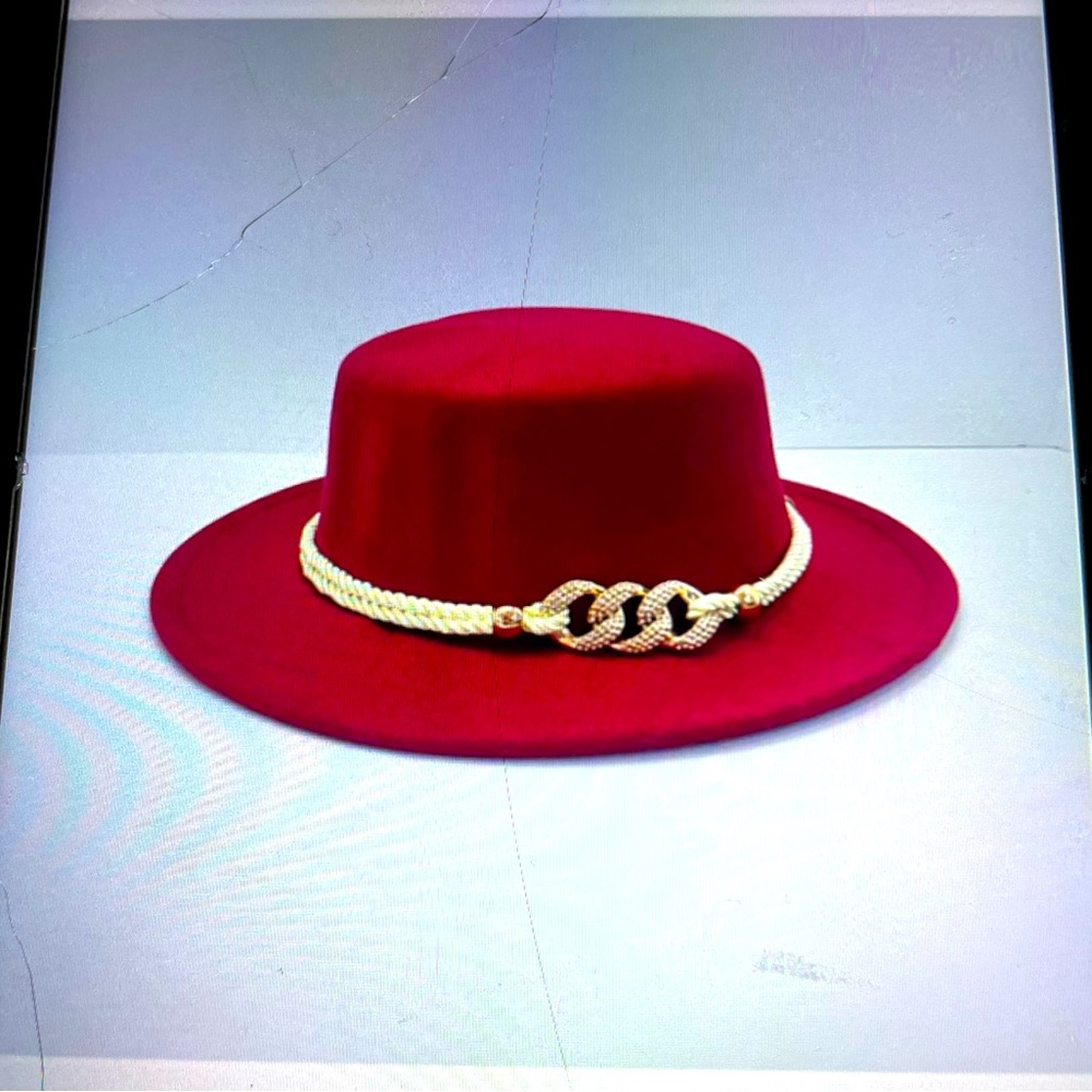 Custom hat with accessories jewelry around the hat . The hat color is burgundy.